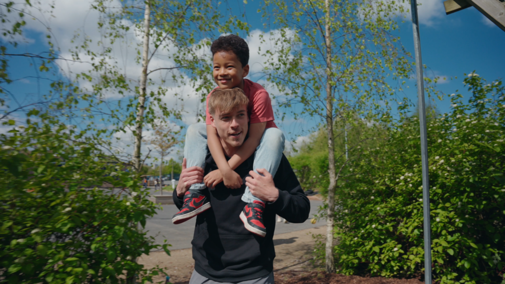 Man with kid on his shoulders